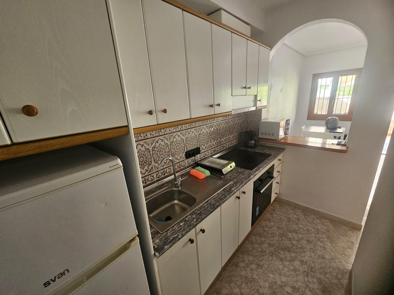 Apartamento con terraza y piscina en Playa Flamenca — 2 dorm. en planta baja